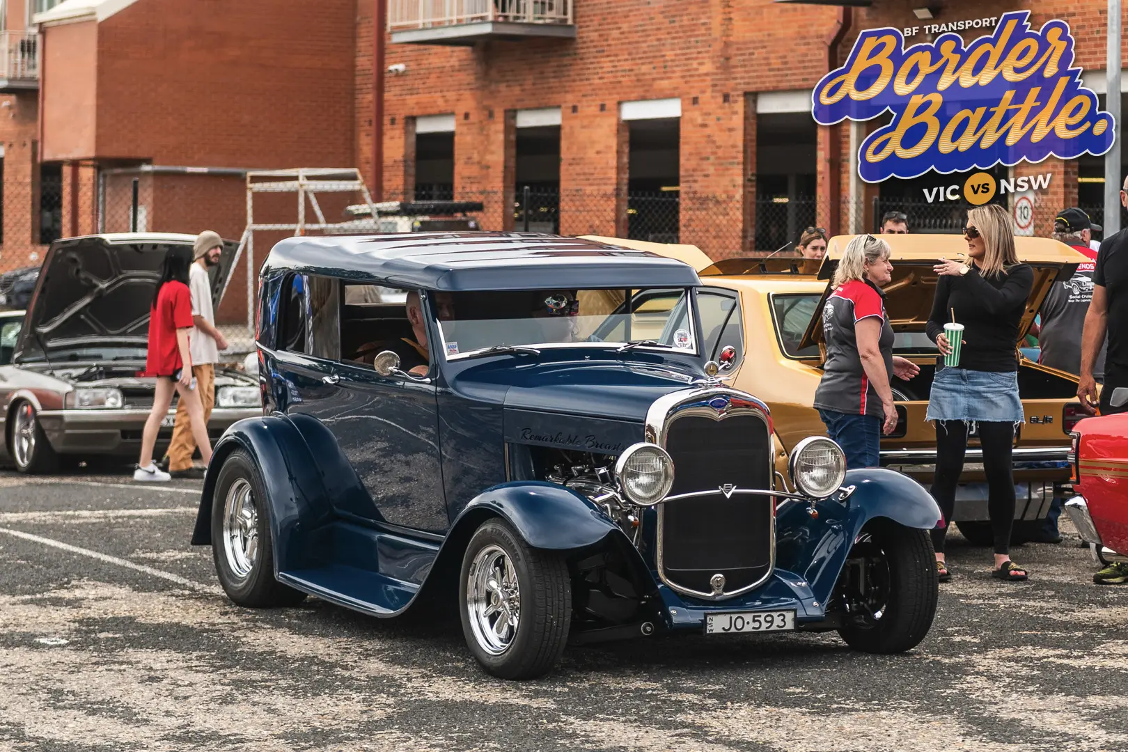 Traditional hot rod on display with spectators at Border Battle