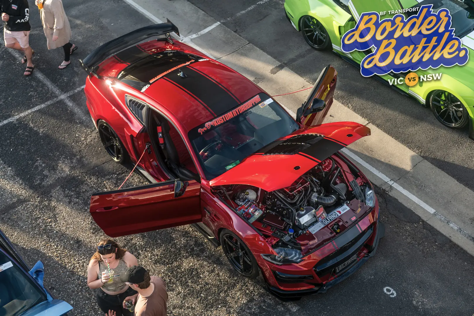 Highly modified red Mustang displayed at Border Battle