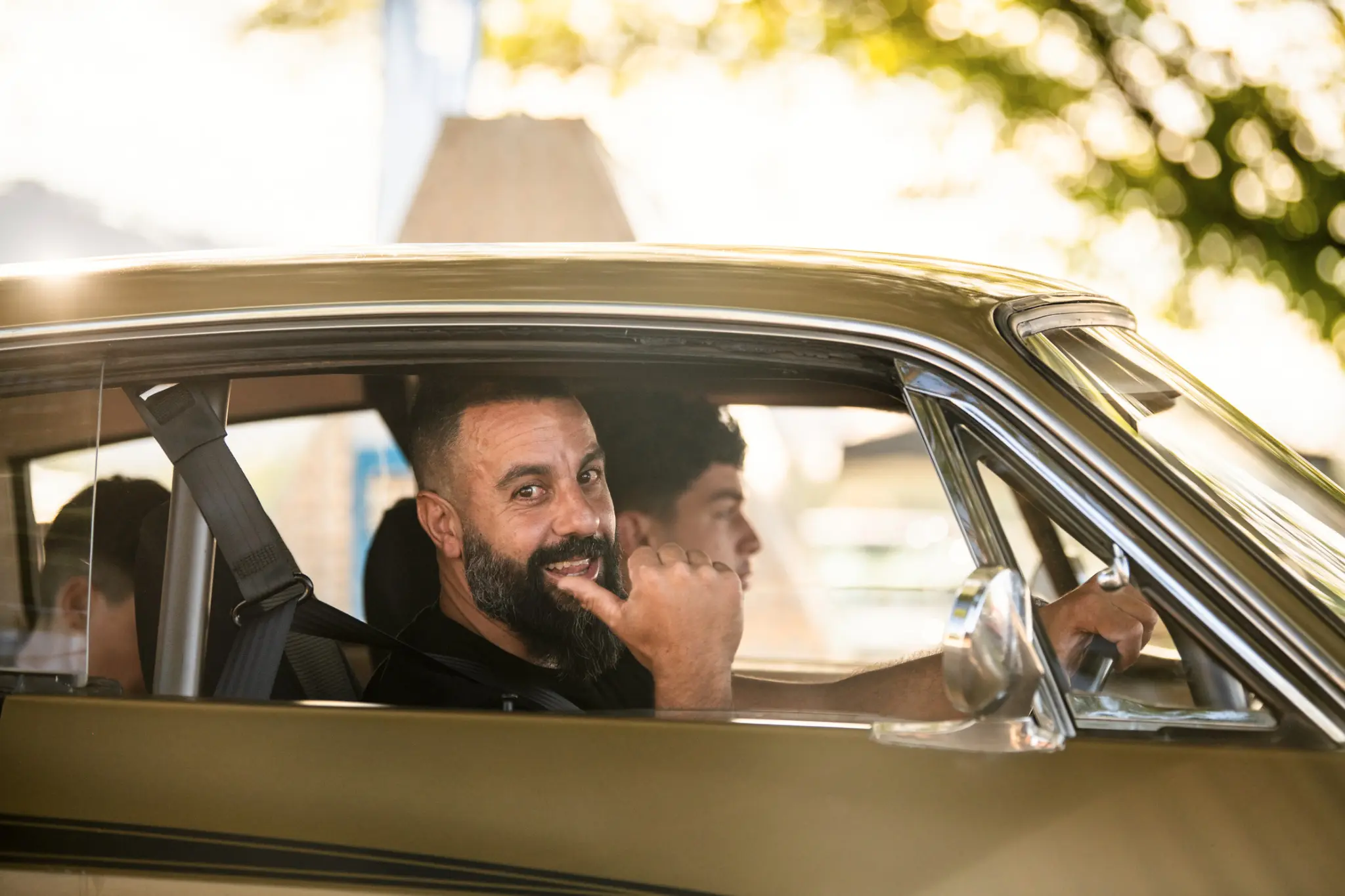 Smiling Chrysler entrant giving a thumbs up from the driver seat