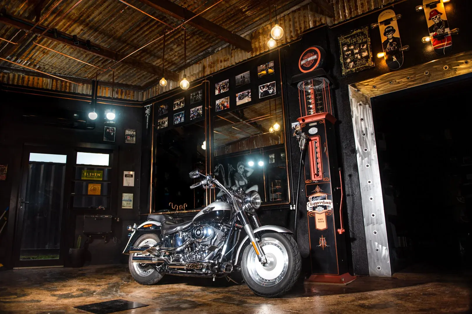Custom motorcycle photographed inside a vintage workshop