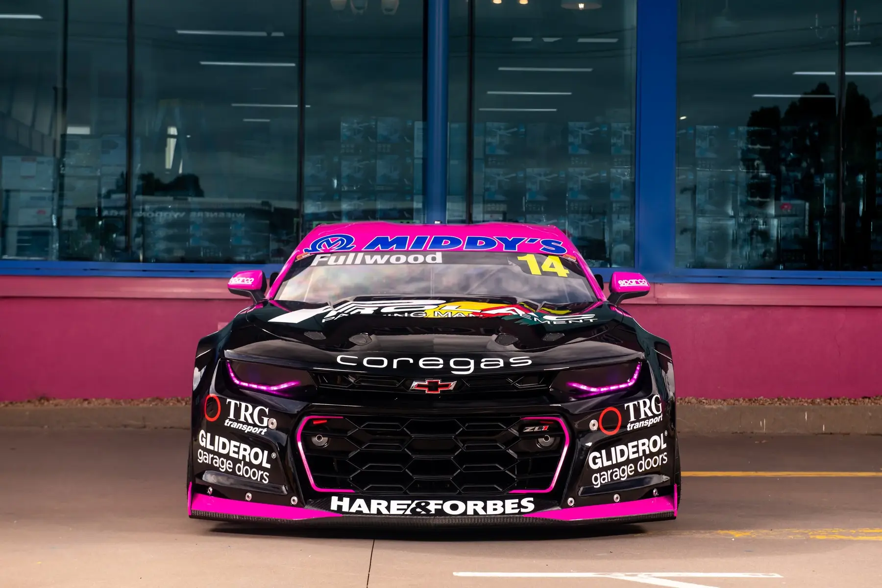 Australian Supercar photographed head-on outside the workshop