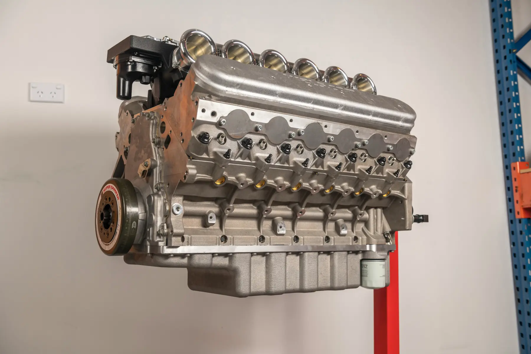 Complete high-performance engine photographed on a stand