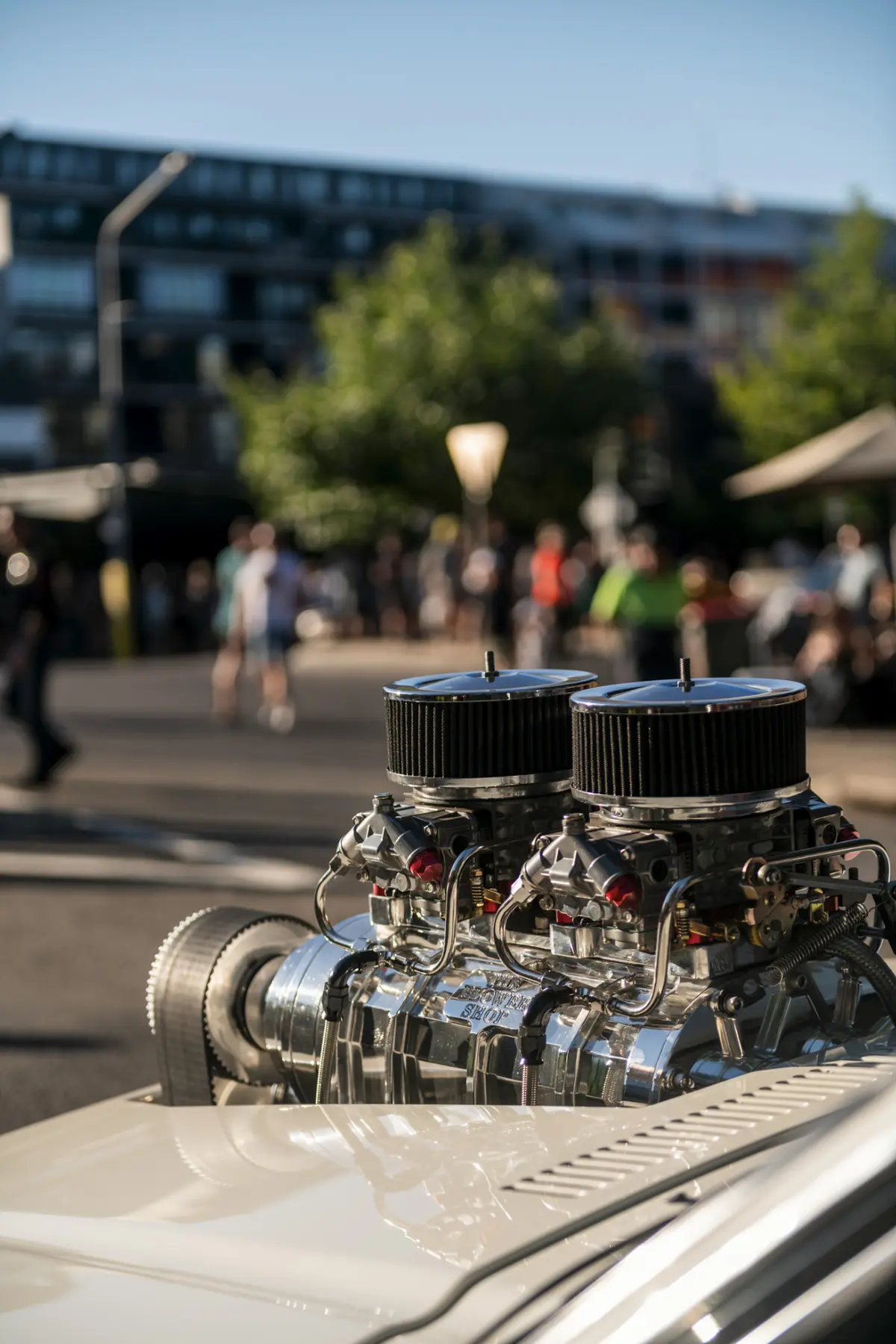 Polished supercharger photographed at an outdoor automotive event